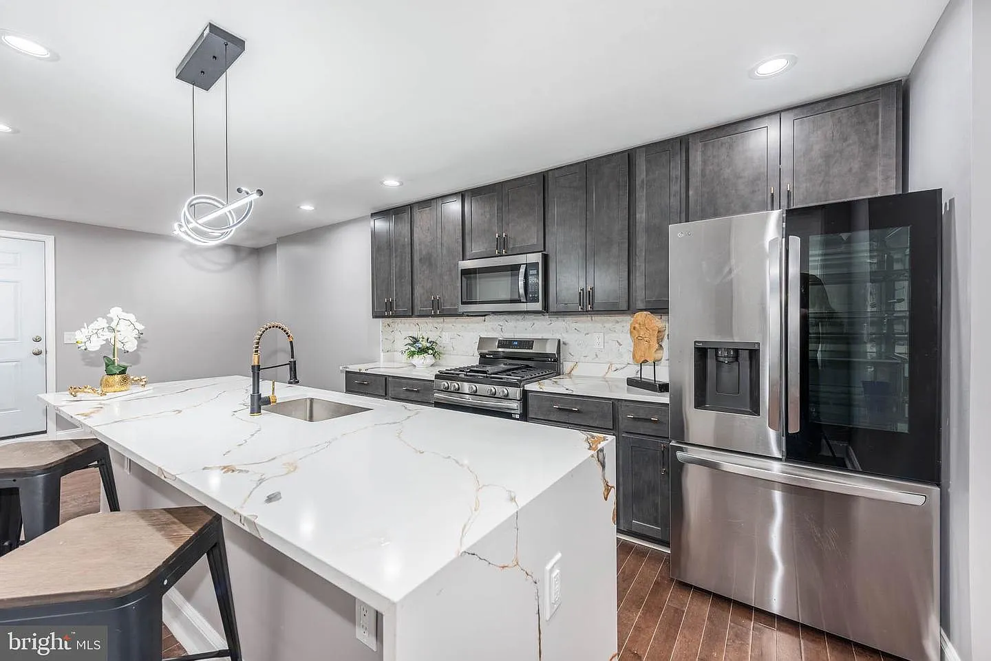 Hollins Market new construction gourmet kitchen with quartz waterfall island